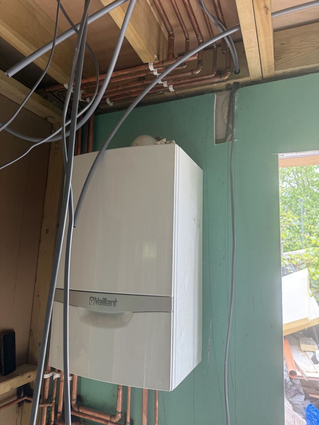 Wall-mounted Vaillant boiler with copper pipework